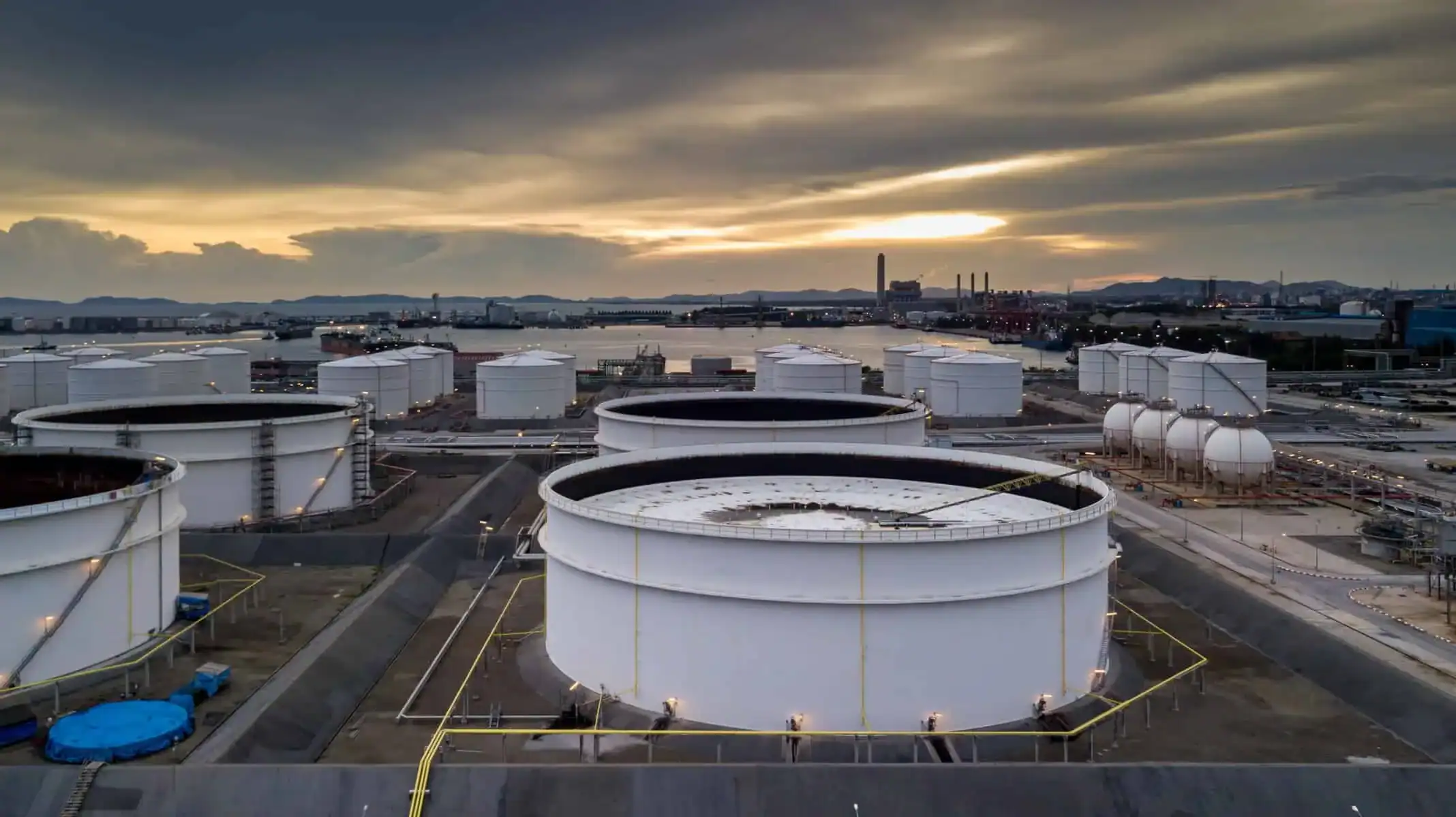 Aerial view of oil terminal tanks and port logistics infrastructure
